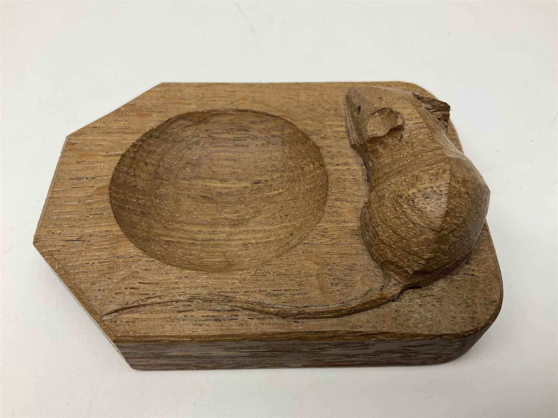 Mouseman oak pin tray, canted rectangular form with carved mouse signature, by the workshop of Robert Thompson, Kilburn, L10cm