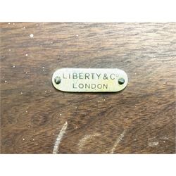 Liberty & Co circa 1890 - walnut centre table, hexagonal form, fretwork frieze, star stretcher base, turned supports on button feet. Stamped on underside.
Featured in - Pictorial Dictionary of British 19th century Furniture Design, Daryl Bennett Liberty's Furniture, 1875-1915, The Birth of Modern Design.
Liberty Style, The Classic Years, 1898 - 1910, by Mervin Levy.