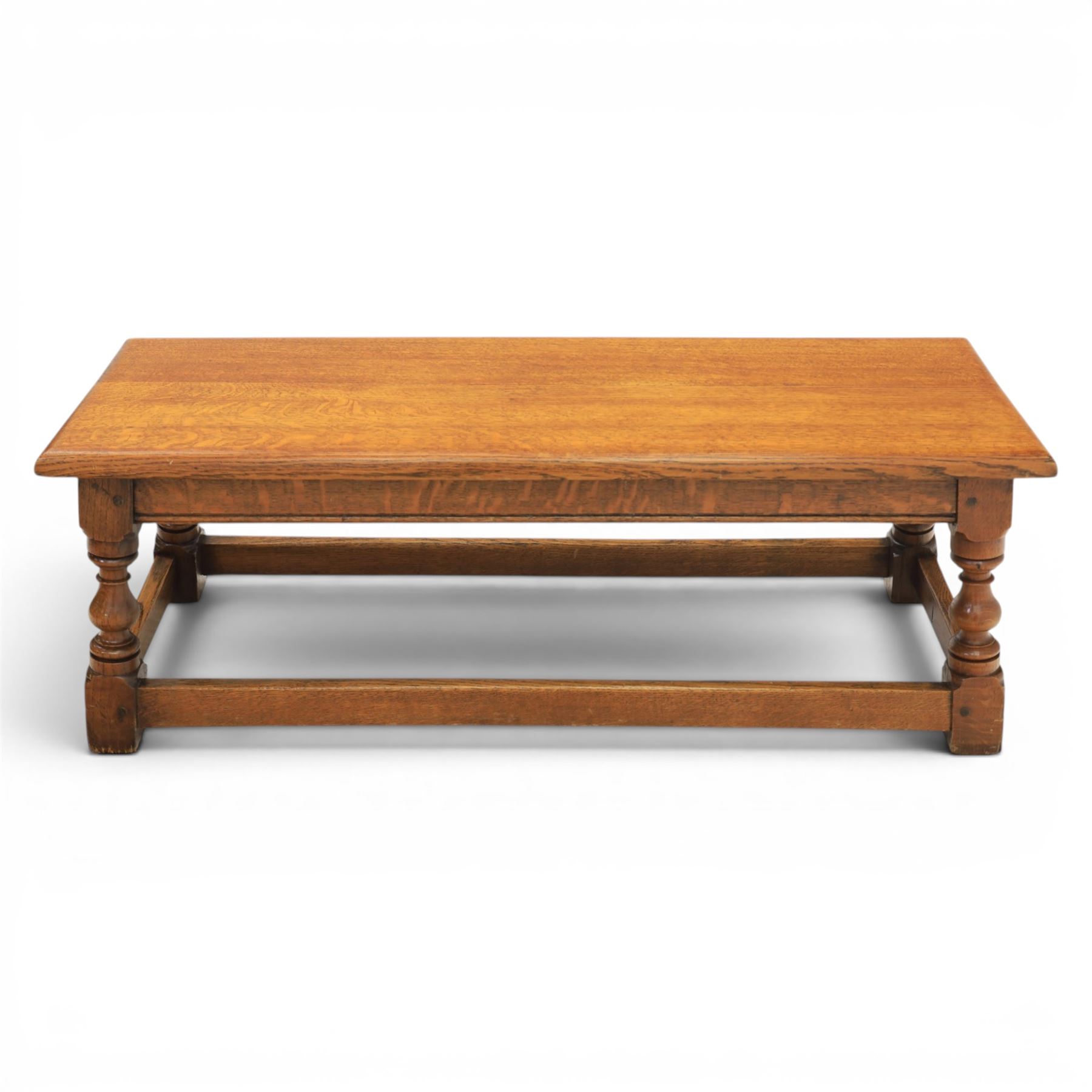17th century style oak long joint stool, rectangular top with moulded edges, raised on turned supports united by stretchers