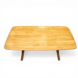 Ercol - mid-20th century golden elm and beech Windsor Range refectory style coffee table, rectangular top with rounded corners raised on end supports with sledge feet