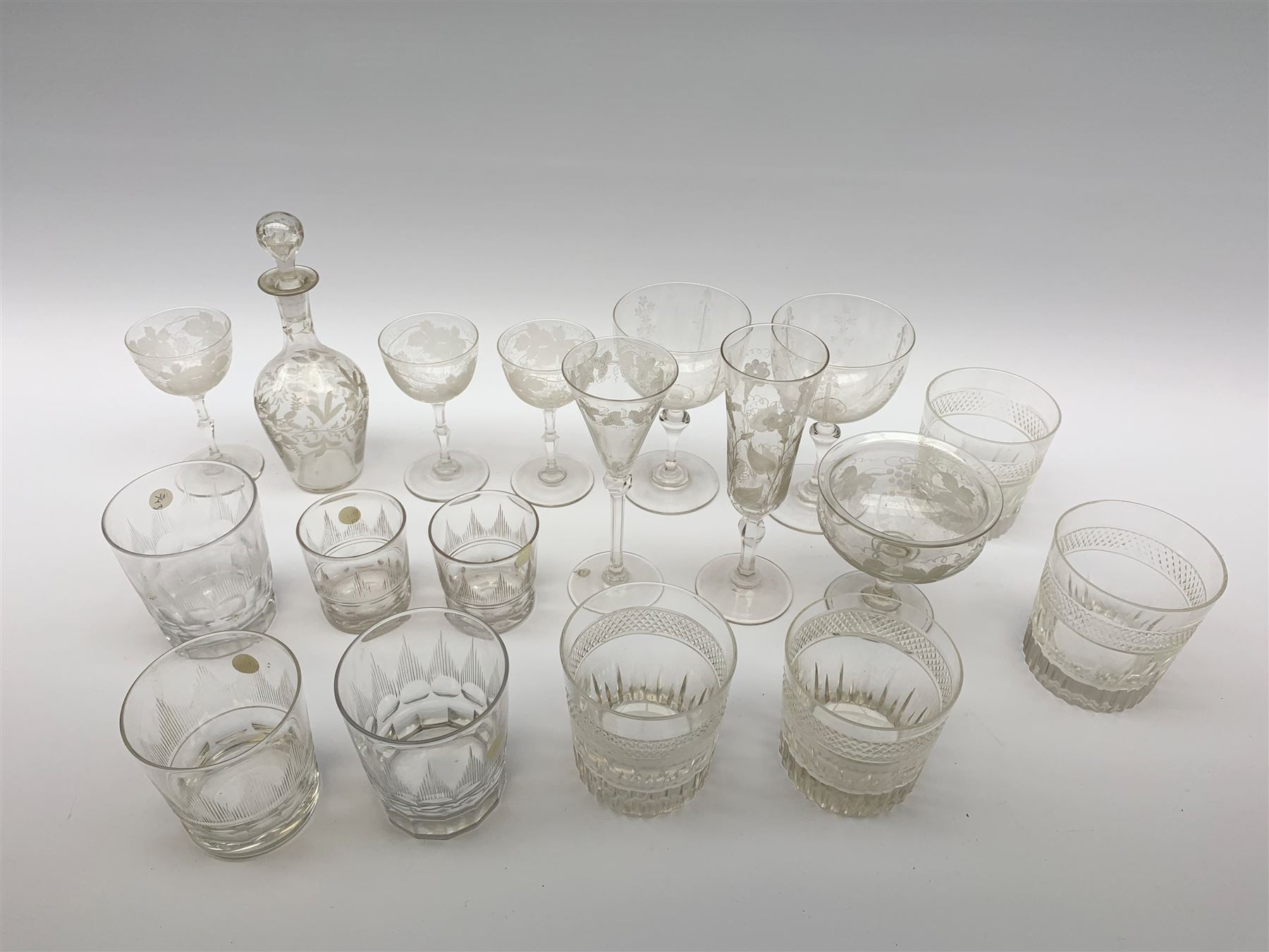 A number of Victorian tumblers and Edwardian drinking glasses, together with a large quantity of other later glassware, to include a glass table lamp base, drinking glasses of various forms, a number with cut decoration, other assorted cut glass including jug, vases, jars and covers, etc. 