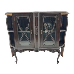 Late Victorian mahogany glazed side cabinet, shaped moulded top over two doors enclosing patterned silk lined shelf, shaped scroll carved apron on cabriole feet