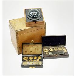 Two Bakelite cased sets of chemistry weights, together with a boxed ship's compass. (3). 