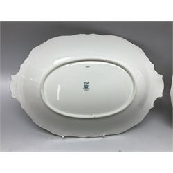 Coalport green batwing pattern tea wares, decorated with finely enamelled floral sprays within gilt reserves, comprising teacup trio, twin handled cake plate and side plate, pattern no Y2665, together with a Coalport for Harrods cup and saucer similarly decorated, the saucer with stamped mark beneath 'Manufactured for Harrods Ltd, Brompton Rd London', all with green Coalport AD 1750 marks beneath, largest W31cm (7)