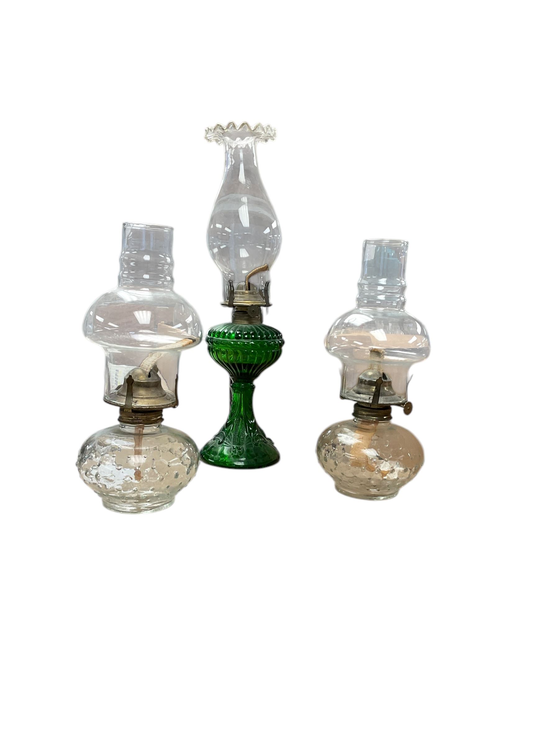 Pair of oil lamps, with impressed mark beneath Farms Lamp Light, together with another oil lamp and two lanterns  