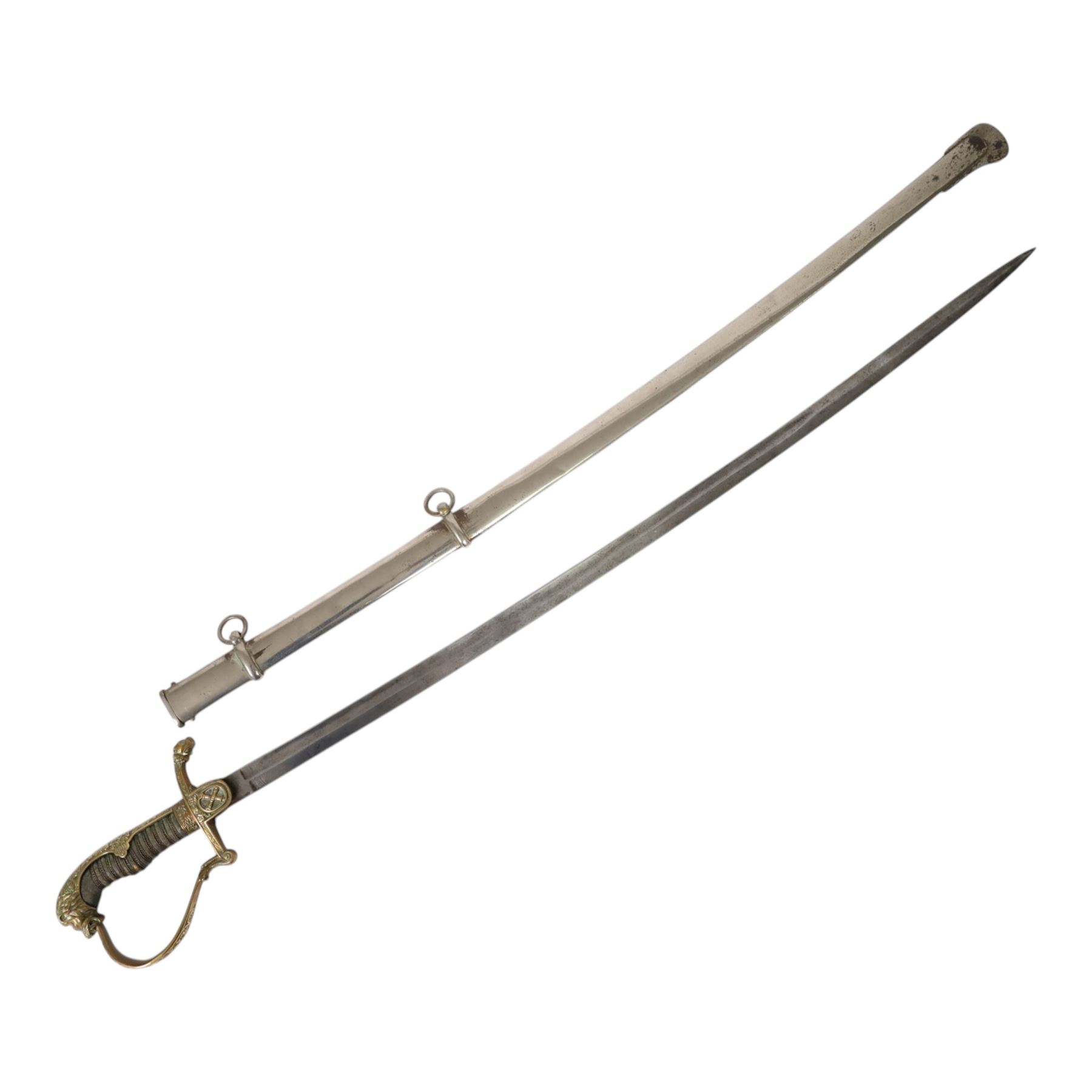 WWI Prussian Artillery Officer's dress sword, with 83cm single edge fullered steel blade, brass stirrup hilt, the langet with crossed cannon barrels and a vacant shield cartouche, the curved knuckle bow cast with acorns and oak leaves, wire bound grip and lion head pommel, with steel scabbard, overall L100cm