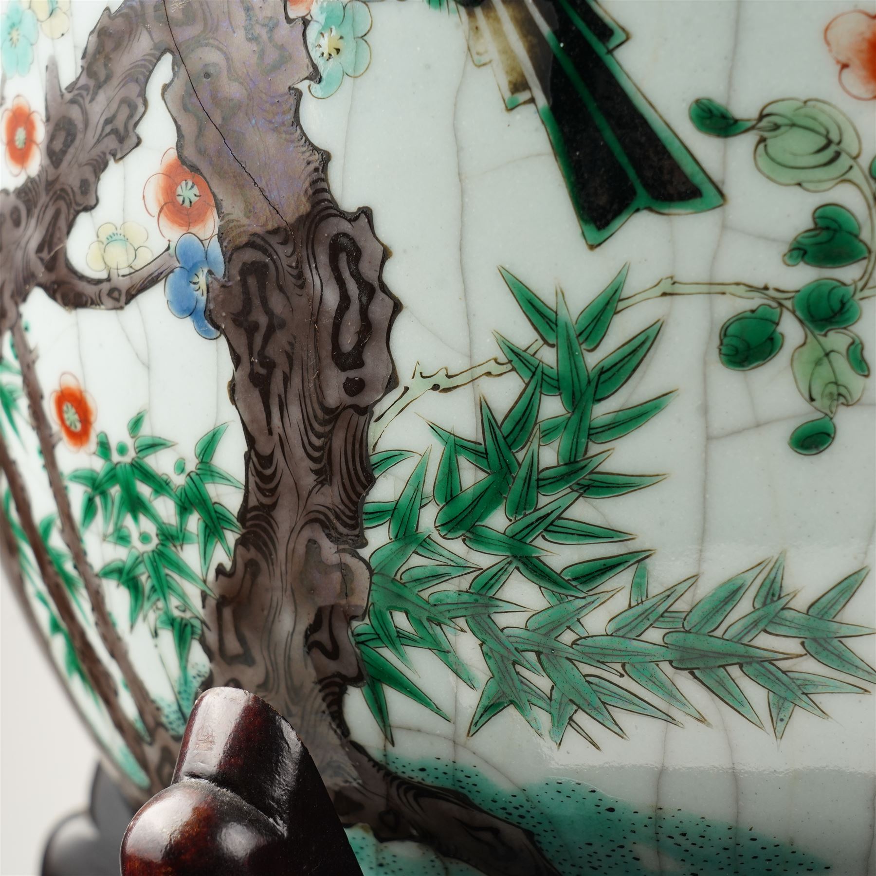 Late 19th century Chinese famille verte crackled ice pot and cover, of ovoid form, decorated with birds, blossom and bamboo, the cover with handle formed as a root, with hardwood display stand H50cm