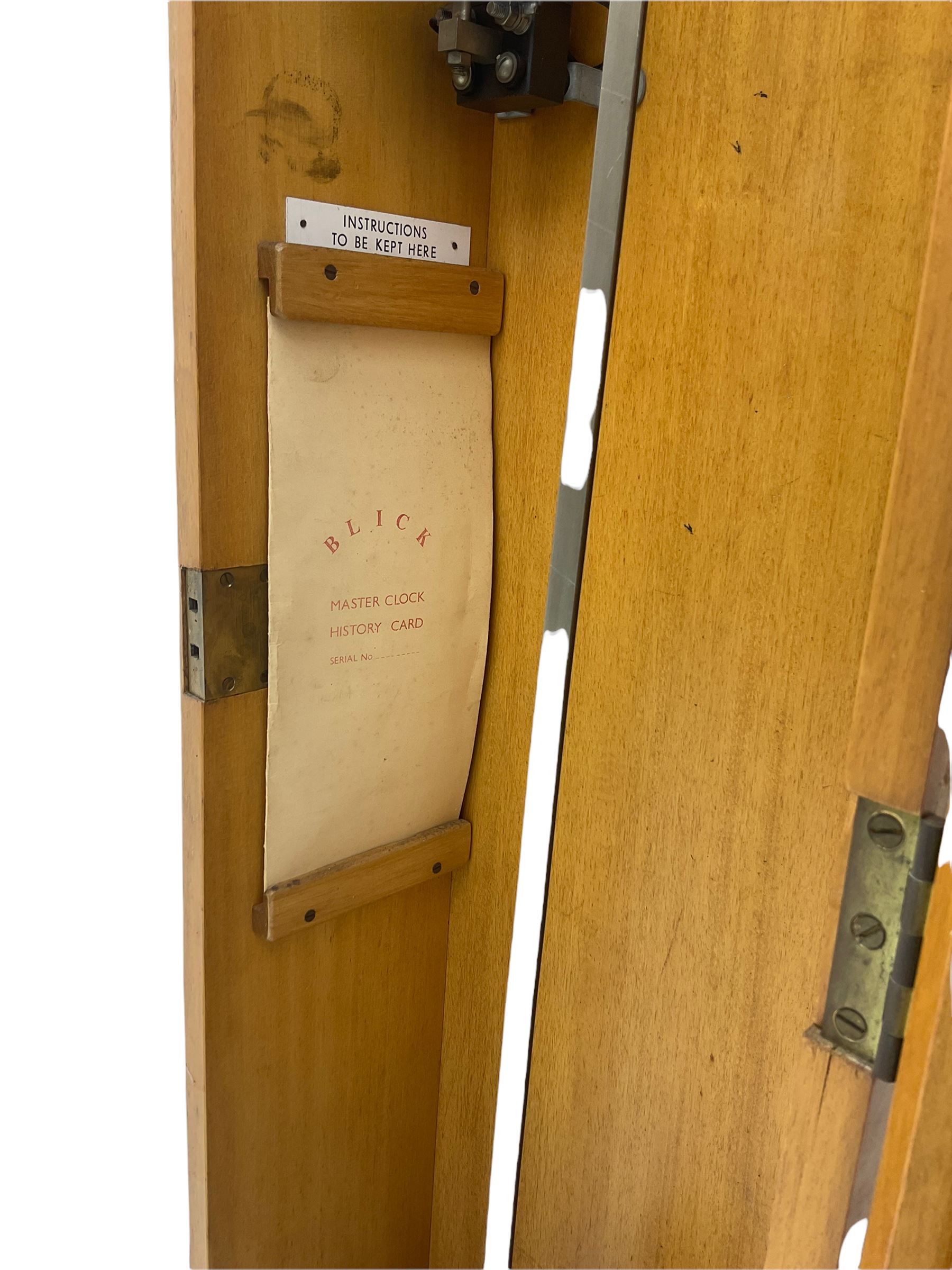 A mid-20th century Gent of Leicester(Blick Electric) Pulsynetic Master Clock in a full length glazed wooden case, with a square white dial with Arabic numerals, minute markers and baton hands, with pendulum and a record card dating from the 1970’s. 
This master clock would have been wired to send time signals to other slave dials in a large building, frequently used in hospitals, schools and factories during the 20th century
With a second electrical movement housed in a glazed square cabinet.


