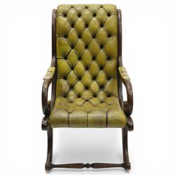 Regency design slipper chair upholstered in buttoned green leather, down swept arms with padded sections, swept back and shaped frames