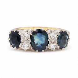 18ct gold sapphire and diamond ring, three graduating oval cut sapphires, the principal st...