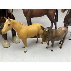 Four Beswick horse figures, comprising Quarter Horse, two Shires no 818 and matt palomino, together with Beswick donkey and Royal Doulton horse on a wooden plinth  