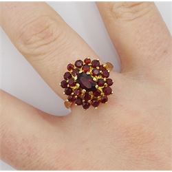 Gold oval and round garnet cluster ring, stamped 9ct