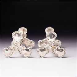 Pair of late Victorian silver knife rests with scroll moulded decoration Sheffield 1898 Maker Lee & Wigfull in original leather box for A & J Thompson, Scarborough 