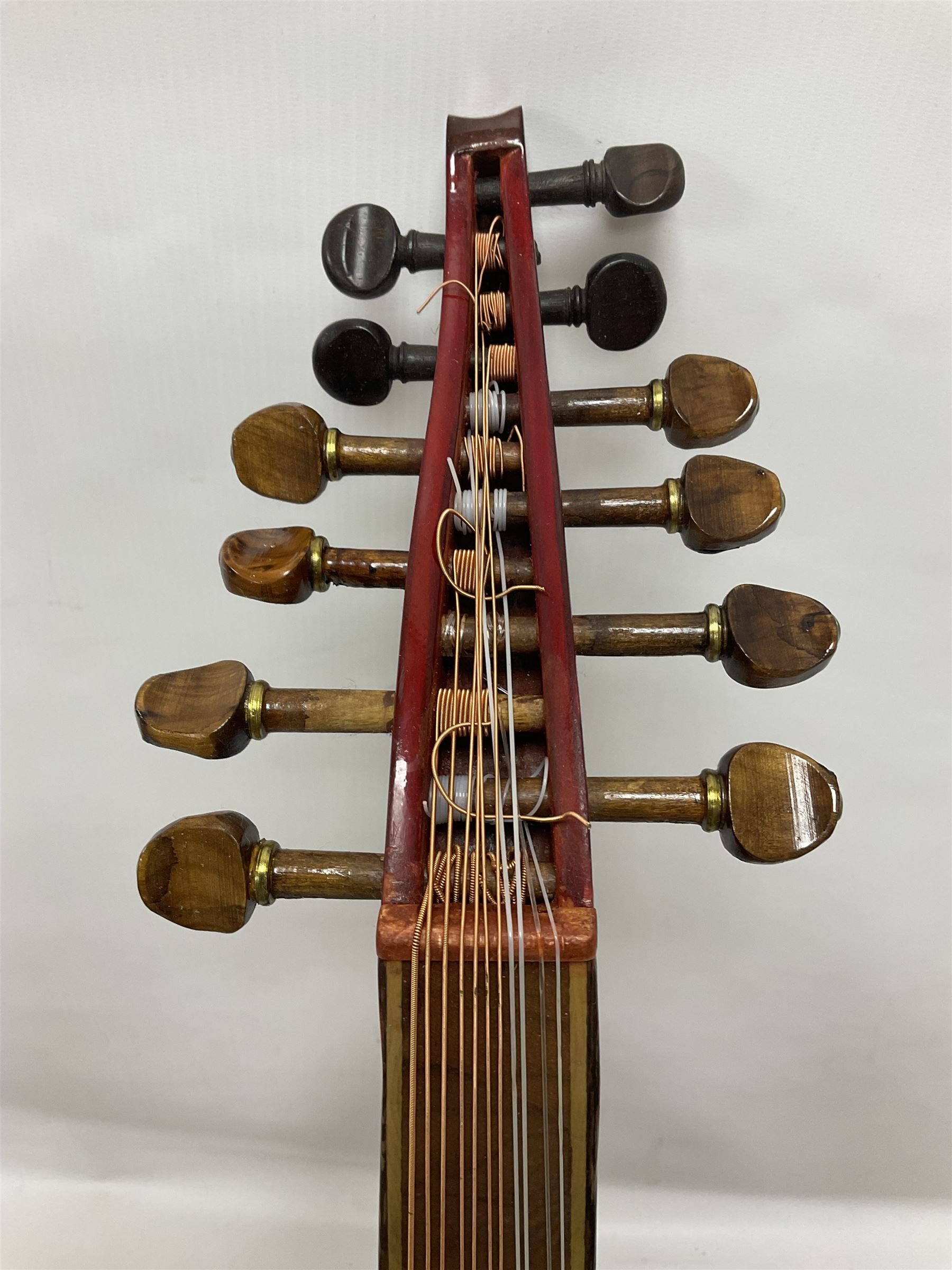 20th century Middle Eastern six string lute with a segmented back and a purpose designed hardwood stand