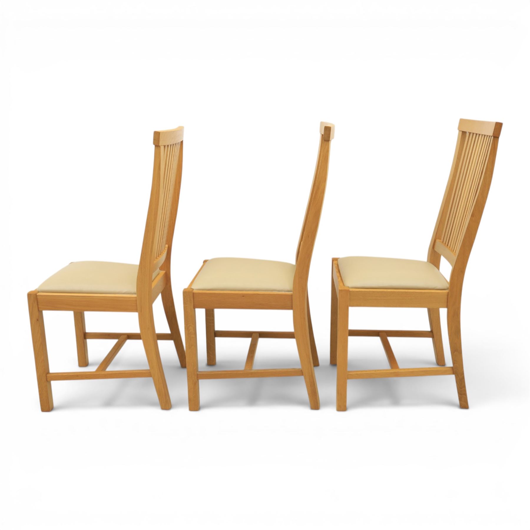 Contemporary oak dining extending table and set of six chairs, with additional leaf  extending to 182cm, chairs with cream upholstered seat