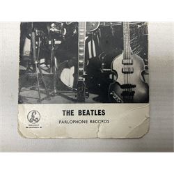The Beatles - Parlophone Records promotional photographic card depicting a very young group standing together behind a pile of musical instruments; signed verso by George Harrison, Ringo Starr, Paul McCartney and John Lennon, inscribed by two members to 'Janet' and also signed by a female 'roadie' F. Holly who had been assigned to look after her 14.5 x 9cm
Provenance: The signatures were obtained by 'Janet', the vendor, at the Majestic Ballroom, Witham, Hull, at their performance on 13th February 1963, when she was sixteen years old. Janet was still recovering from being injured in a car accident so was removed from the packed audience to watch the performance from the wings where she acquired the signatures, personally watching each member of the band sign the card. Whilst signing the card the Beatles asked her to attend a party later that night at their hotel in Hull but she declined as she was too young and had to return home by 11pm!