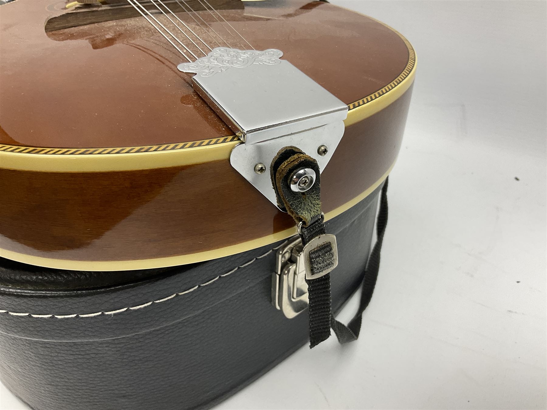 Palmer eight-string mandolin with mahogany back, simulated ivory and mother-of-pearl mounts L67cm; and Mahalo mahogany cased baritone scale ukulele, model no.U320B, L76cm; in hard carrying case (2)