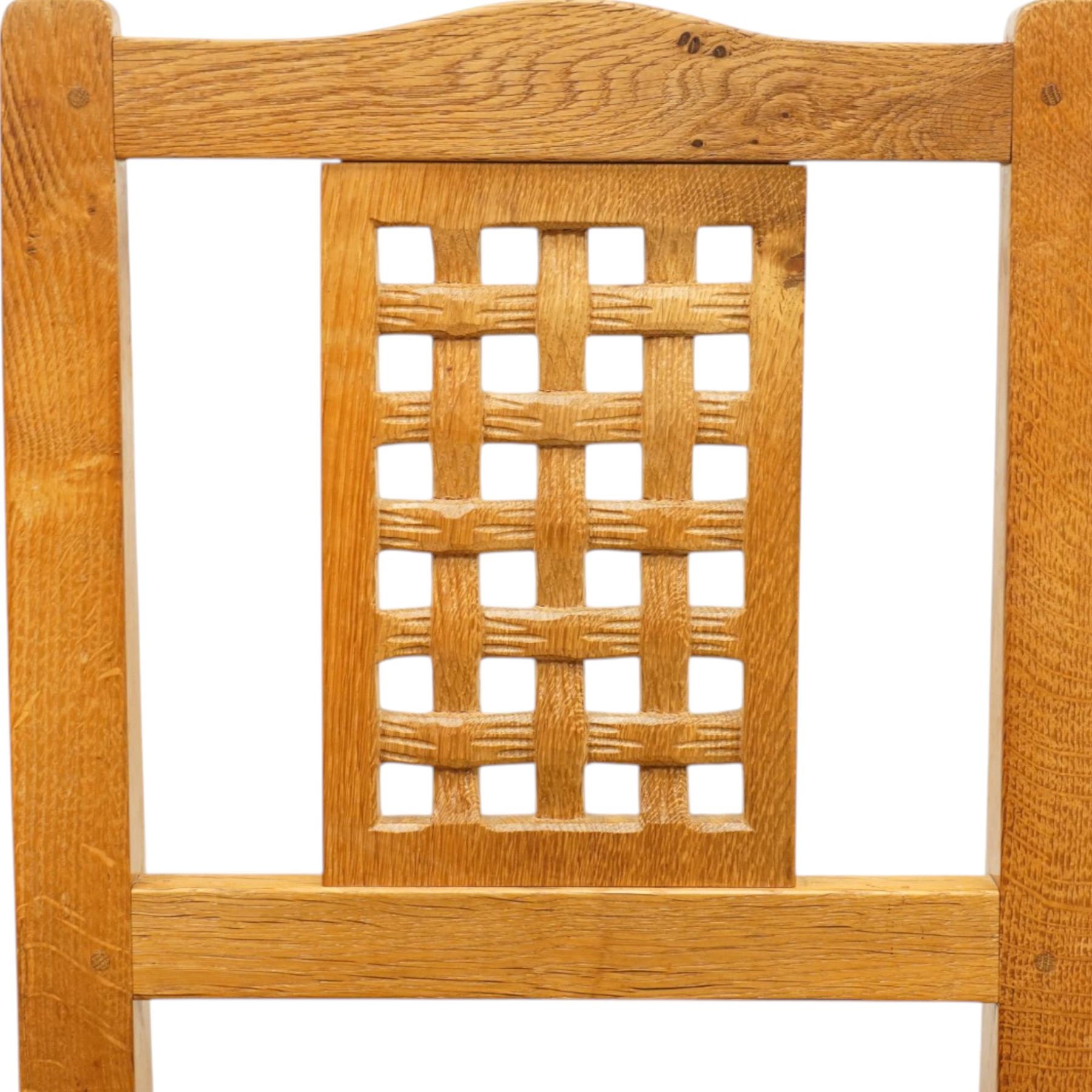 Beaverman - 1980s set of four lattice back dining chairs, shaped top rail above a lattice back, green leather fixed seat, raised on octagonal front supports, with carved Beaver to the back stretcher, by Colin Almack of Sutton near Thirsk