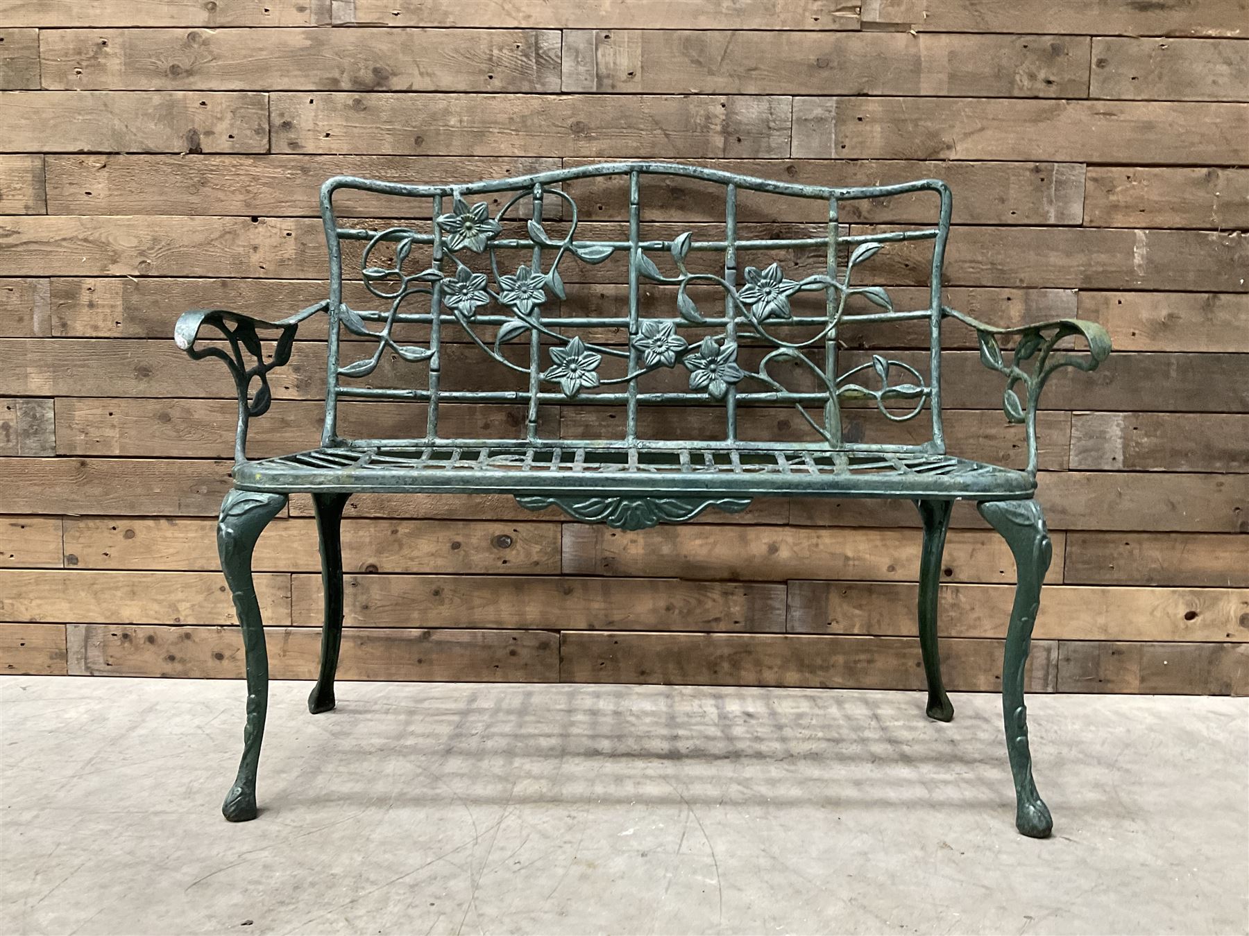 Cast aluminium garden dining set, comprising ornate circular table (D91cm, H68cm) a two seater bench, on cabriole supports (W118cm, H93cm, D55cm), and two matching armchairs (W55cm, H95cm, D54cm)
