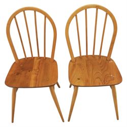 Ercol - set of four 'Windsor' waxed elm chairs, with hoop back design, on tapering supports