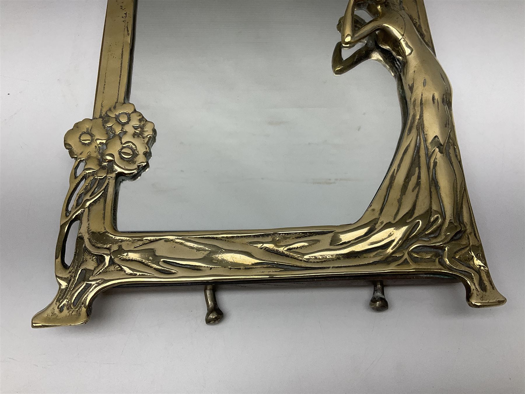 Art Nouveau style mirror in the manner of WMF, decorated with a female figure and floral motifs, the easel support verso with spurious WMF, H35cm