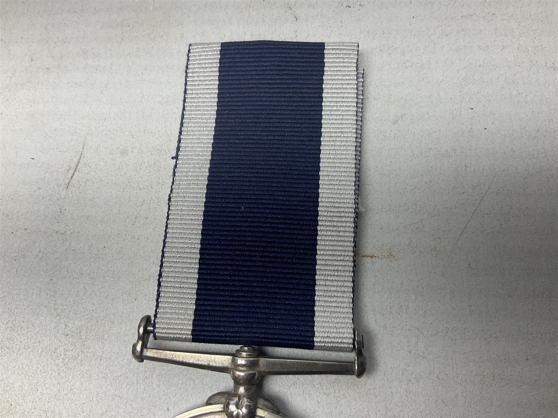 Victoria Naval Long Service and Good Conduct Medal with narrow suspender, awarded to Chas. Norris, Ch. Boatn. H.M. Coast Guard.; with ribbon