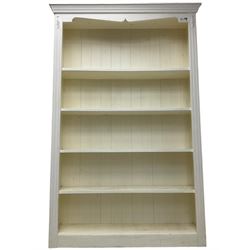 White painted open bookcase, projecting moulded cornice over four shelves, fluted uprights, on plinth base