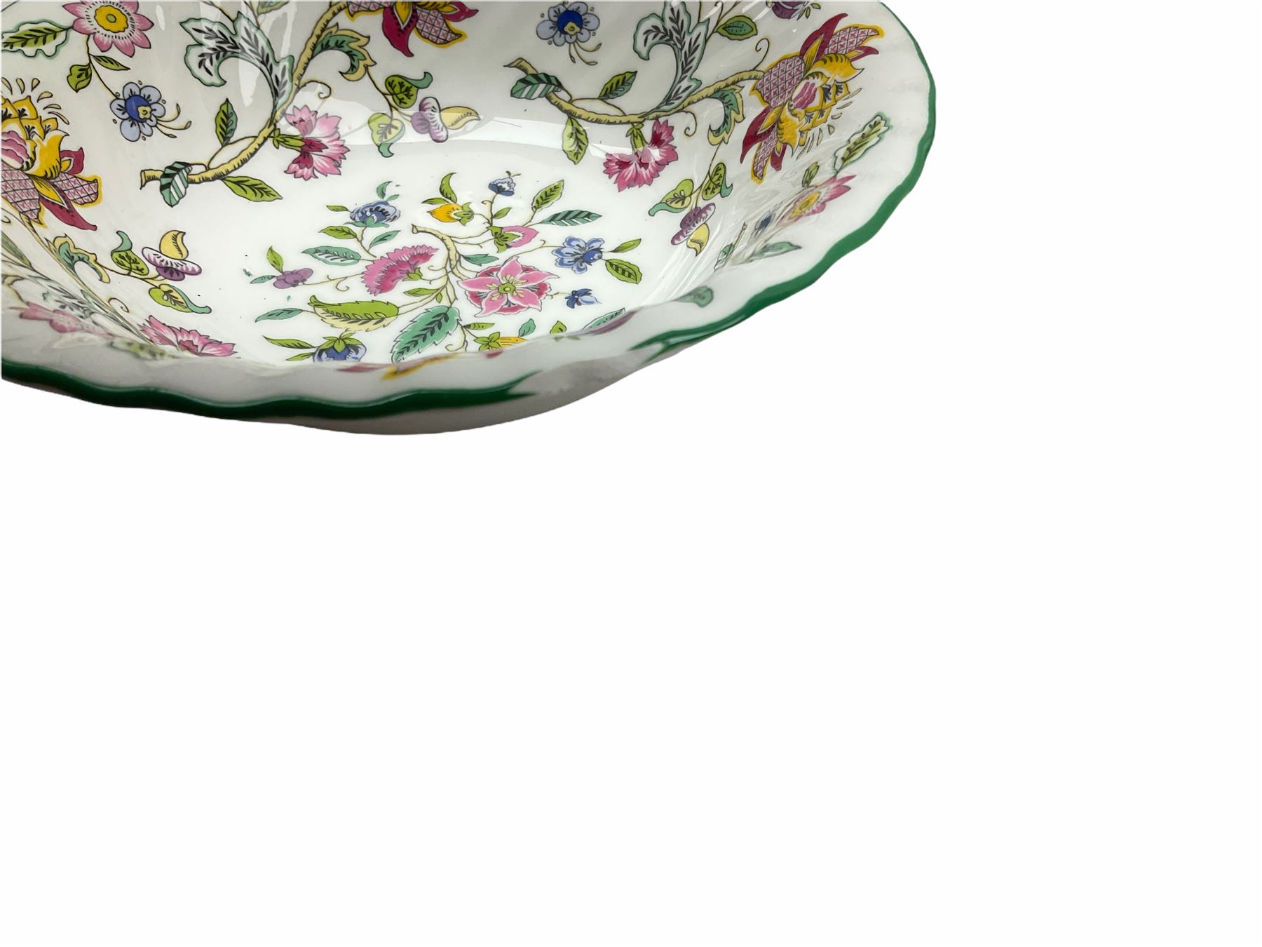 Minton Haddon Hall pattern tea and dinner wares, including basket dish, two covered tureens, six dinner plates, eight dessert plates, twelve tea plates, six soup bowls, six cereal bowls, teapot, coffee pot, milk jug, covered sucrier twelve tea cups and saucers, six mugs, footed bon bon dish, pair of candlestick holders, cake knife and slice etc (81)