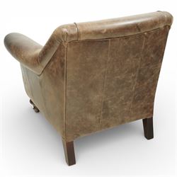 Tetrad - late 20th century leather armchair, upholstered in brown leather with a gently curved back and rolled arms, loose seat cushion over a padded base, raised on turned wooden feet