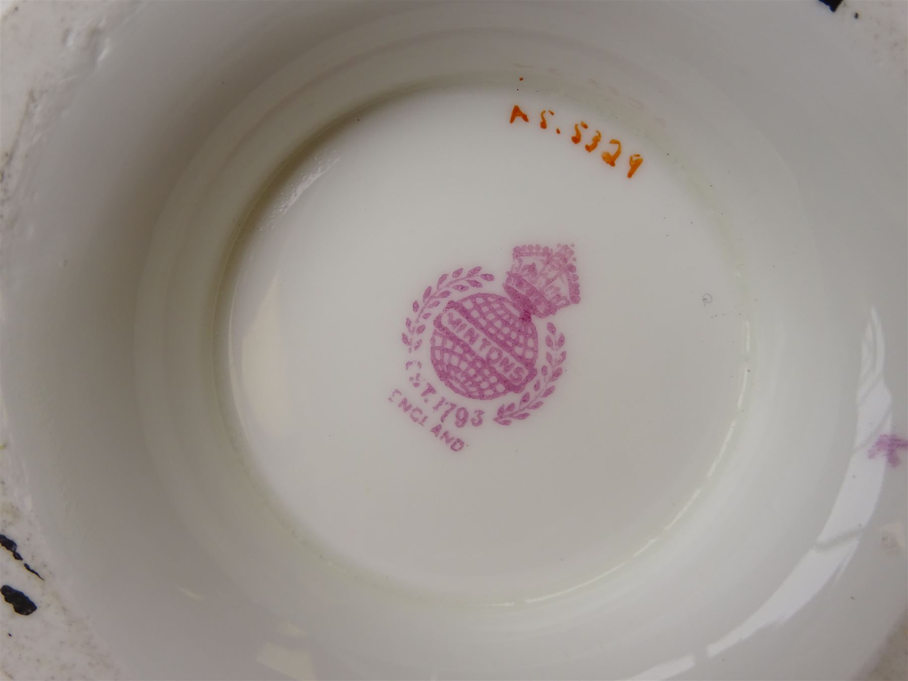 19th century Minton tea set, comprising twelve teacups, eleven saucers, fifteen side plates, cream jug, slop bowl, and two cake plates, decorated with panels of floral sprays, upon a green ground, heightened with gilt throughout, with printed puce mark beneath, and pattern number 5329
