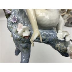 Four Lladro figures, comprising Touch of Class no 5377, Boy Student no 4517, Ocean Beauty no 5785 and Carnival Couple no 4882, largest example H45cm