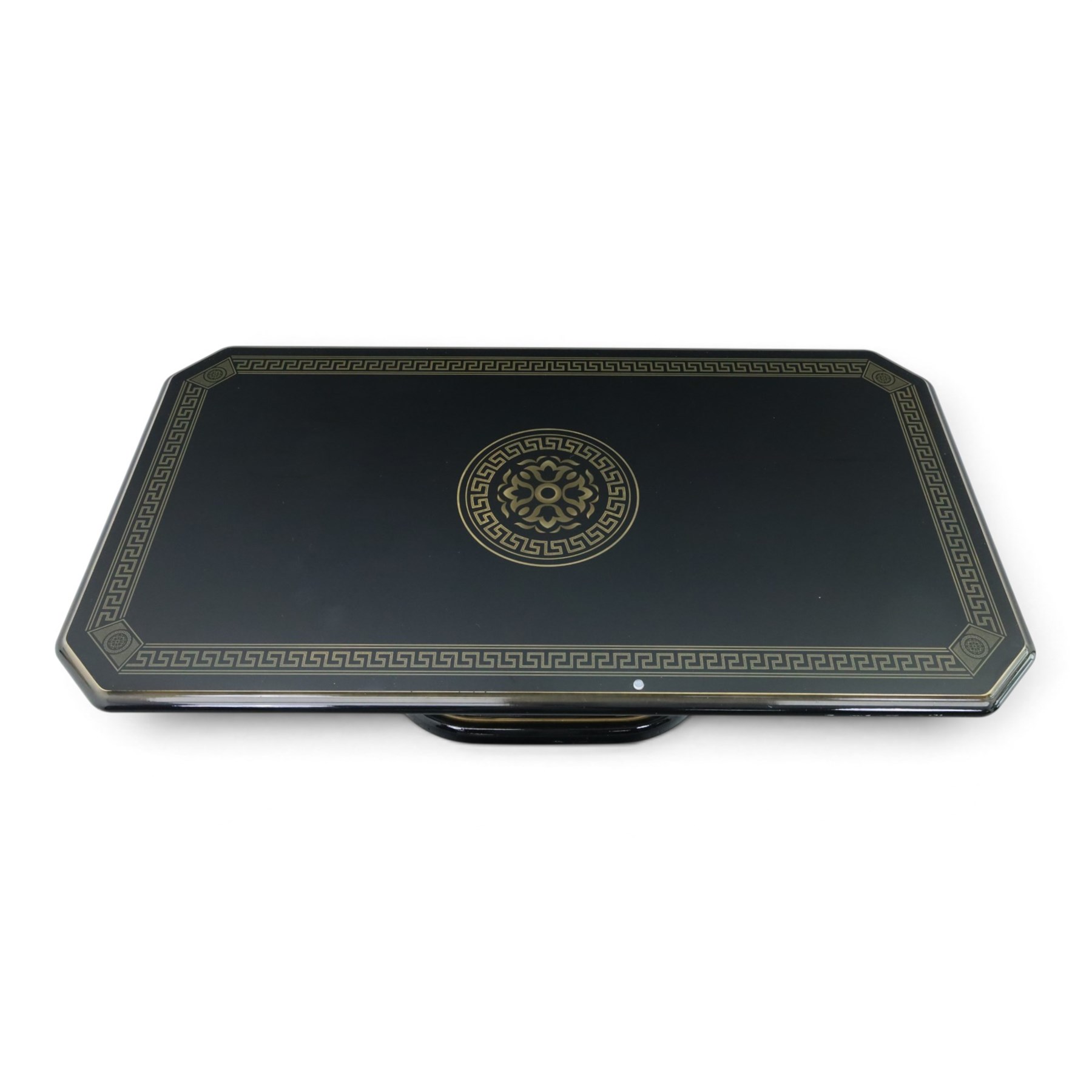 Italian Neoclassical inspired ebonised gloss coffee table, glazed cantered top with Greek key banding, on a shaped pedestal base with gilt highlights and stepped plinth 