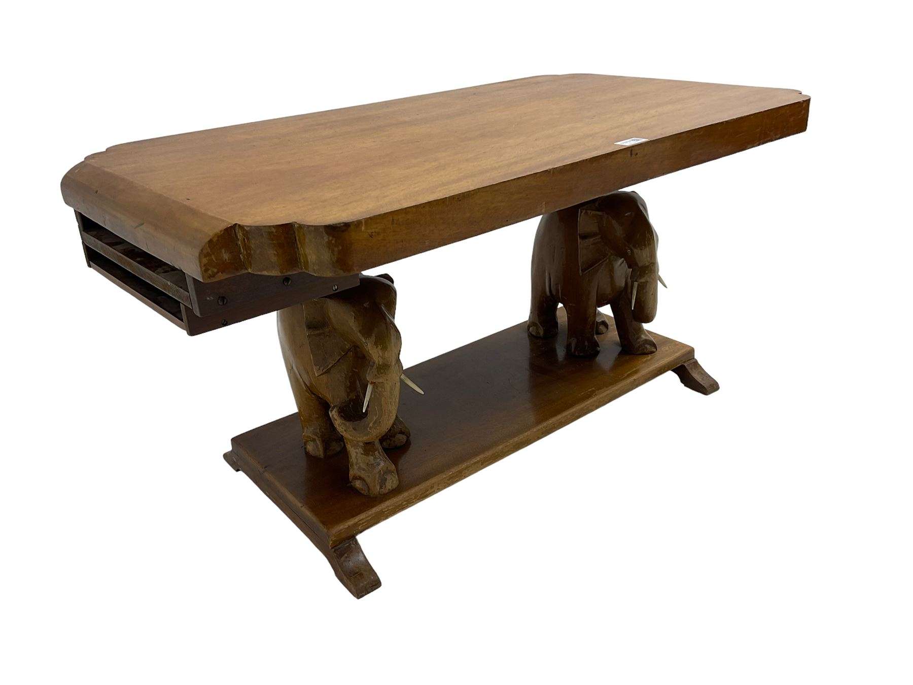 Hardwood coffee table on carved elephant figure supports, platform base on sledge feet