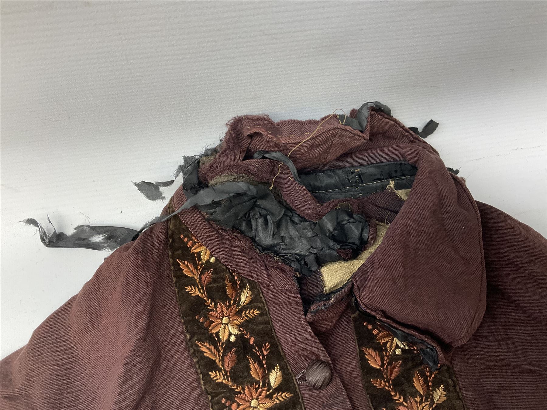 Victorian ladies riding habit, the two-piece construction in brown with embroidered floral velvet edging