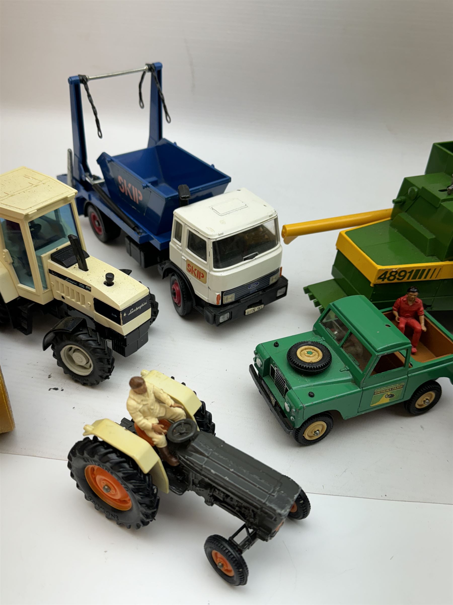 Collection of predominantly late 1970s/early 1980s Britains diecast vehicles and farming equipment, including Corn King, tractors, JCBs, horsebox, skip lorry, etc together with figures and accessories