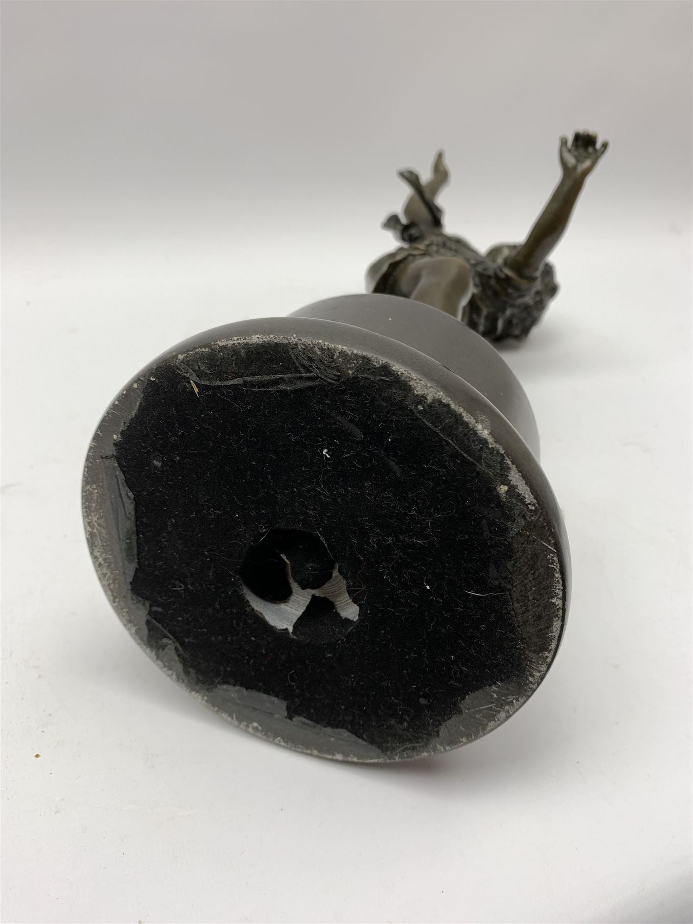 After E Plat, bronze modelled as a dancing child, signed E. Plat, upon cylindrical black marble base, H40cm