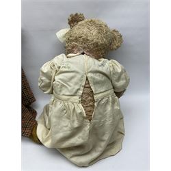 Two early 20th century straw filled jointed teddy bears, first example wearing a tweed jacket bearing Geoffrey Saville label, with leather padded paws and ears, horizontally stitched nose and humpback; second example with applied eyes, vertically stitched nose and faux leather paw pads, both with growler mechanisms, tallest H74cm 