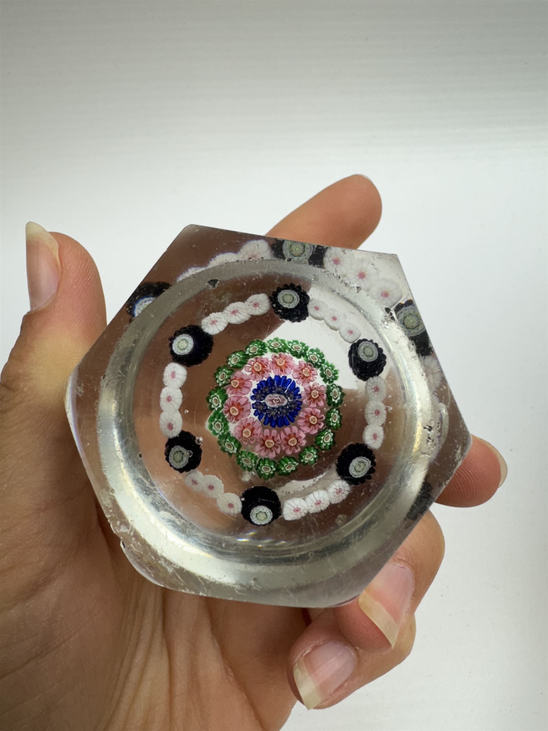 Glass Millefiori paperweight of hexagonal faceted form, H5cm