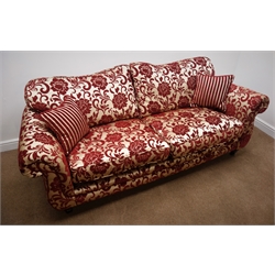  Two Grande sofas upholstered in embossed a red and gold fabric with complimentary scatter cushions and arm-covers, W220cm  