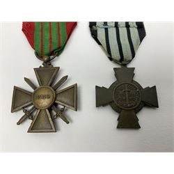 Four French medals - St. Helena medal with bust of Napoleon to obverse and inscription to reverse 'Campagnes de 1792 a 1815. A ses compagnons de gloire sa derniere pensée Ste. Hélène 5 Mai 1821', established by Emperor Napoleon III in 1857; two WW2 Croix-de-Guerre; and WW2 Croix-du-Combattant; all with ribbons (4)