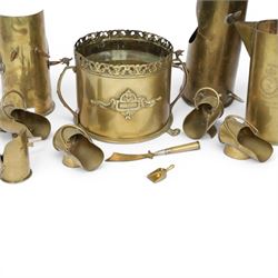 Trench Art shell case jardiniere, with pierced rim and paw feet, Jug marked The British General Hospital  January 1918 April 1919, seven miniature coal buckets and a sword   