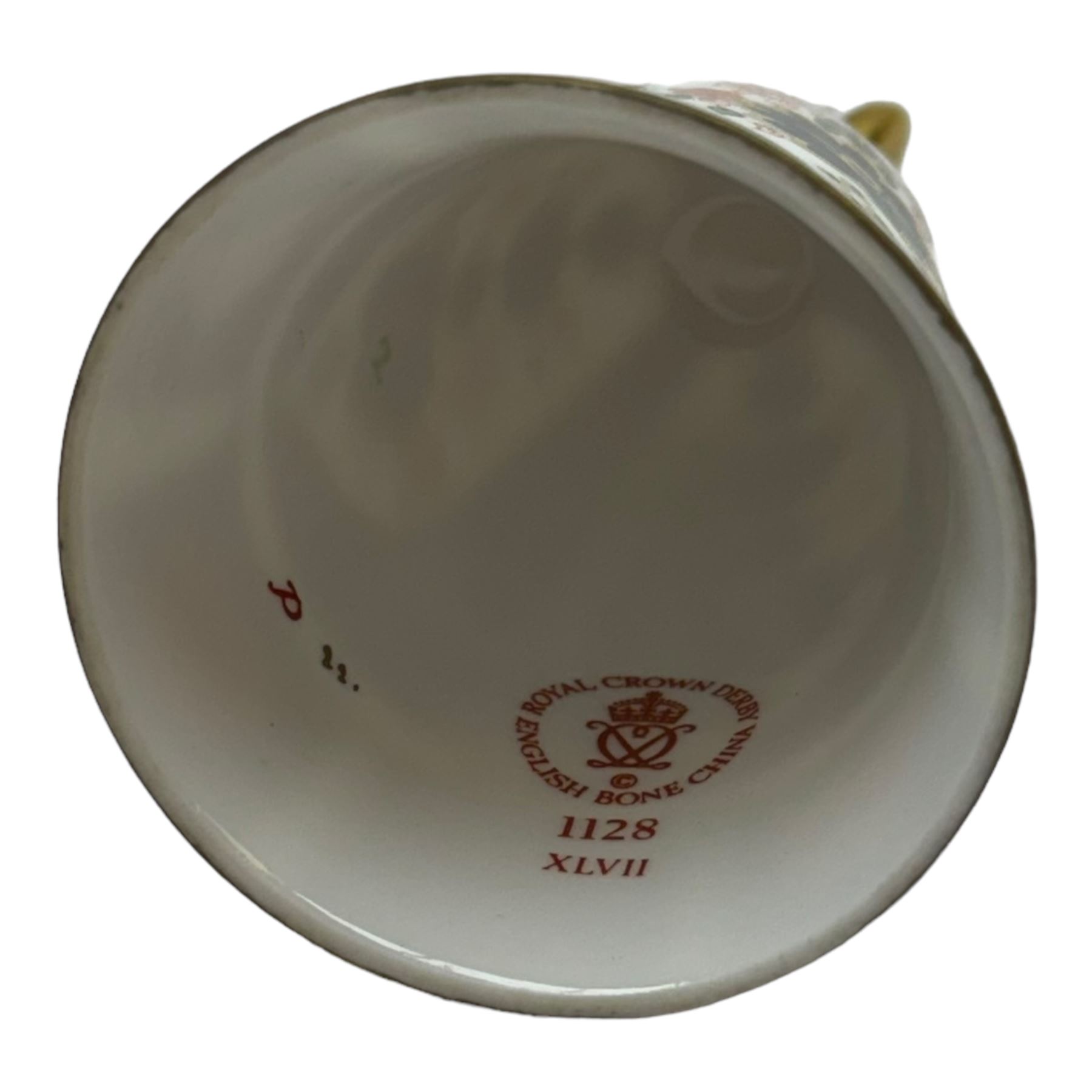 Collection of fifteen Royal Crown Derby thimbles upon an ebonised display stand, together with Royal Crown Derby candle snuffer in Imari pattern 1128