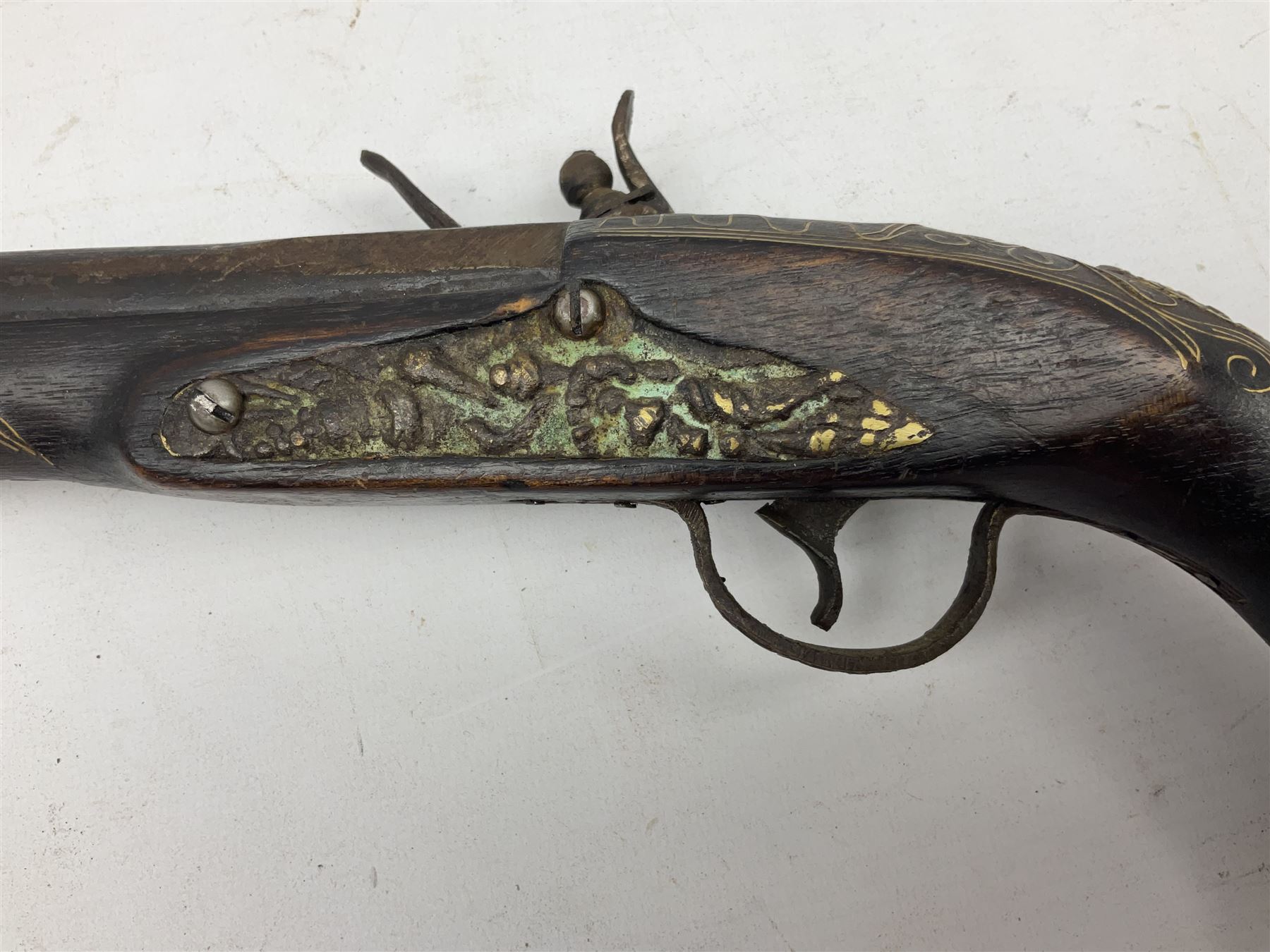 Reproduction flintlock pistol, the full walnut stock with brass filigree inlay and mounts and skull crusher butt L46cm; no visible proof marks FIREARMS CERTIFICATE REQUIRED OR RFD