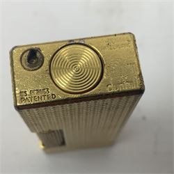 Dunhill gold plated dress lighter, in original fitted case with paperwork, together with a Dunhill rolagas lighter