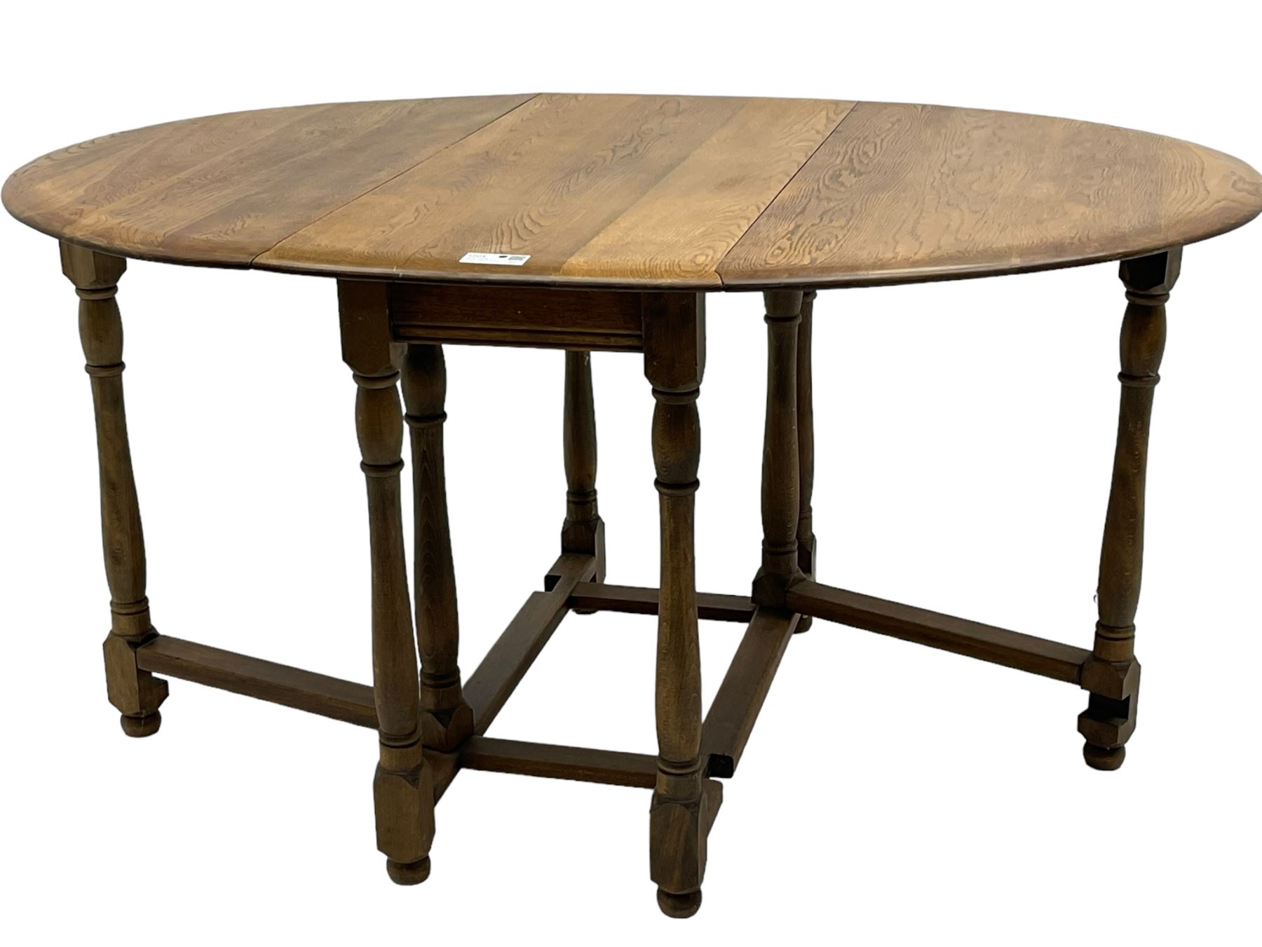 Mid-to-late 20th century oak and beech drop-leaf dining table, gate-leg action base with turned supports
