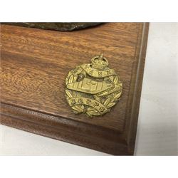 Early 20th century mechanical money bank 'Tank and Cannon' by Starkies, mounted on an oblong mahogany base with WW1 Tank Corps cap badge; patented 16th January 1919 L29.5cm
