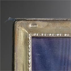 Late 20th century silver photograph frame, rectangular with beaded decoration to inner edge, blue velvet easel style support verso, hallmarked Carrs of Sheffield Ltd, Sheffield 1995