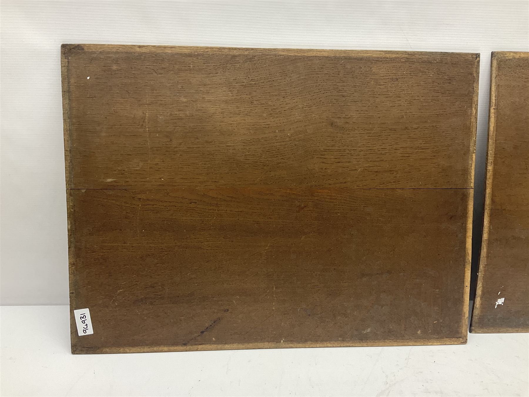 Pair of oak furniture door panels, carved in relief with a fox to one and a hound to the other, together with a pair of smaller oak panels, carved in relief with a hare to one and a grouse to the other, doors W63.cm x H62cm, panels W43cm x H60cm