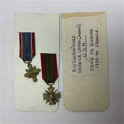 Two WWI American Victory Medals - one Army with Russia clasp, the other Navy/Marine Corps with Patrol clasp; American miniature Distinguished Service Cross and French miniature Croix de Guerre; all with ribbons (4)