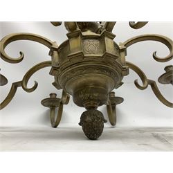 20th century heavy brass eight branch electrolier, detailed with putti masks, approximately H60cm W71cm